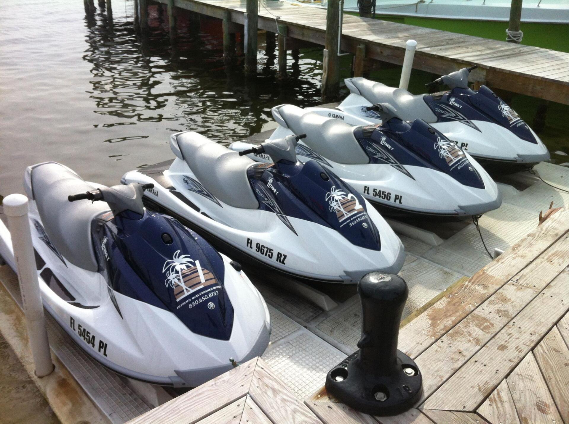 A row of Luther's WaveRunners tied along the dock