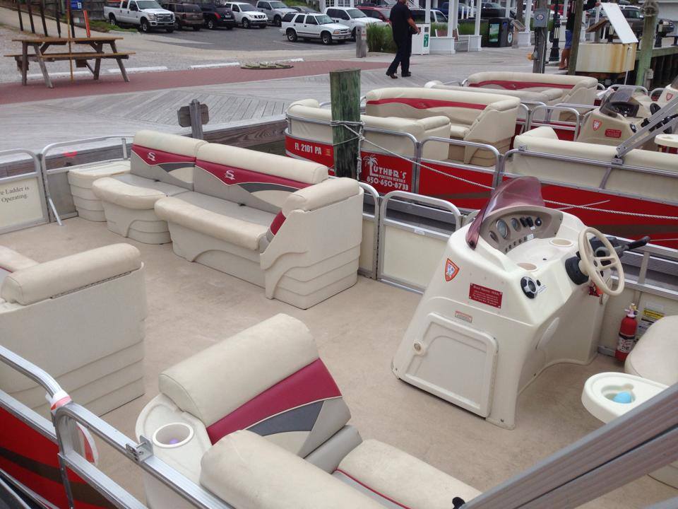 Inside a Luther's pontoon: cushioned seating and the helm