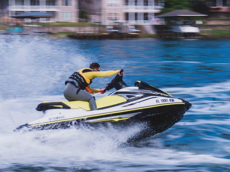 A rider on a Yamaha WaveRunner throwing spray